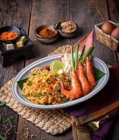 a white plate topped with shrimp and rice