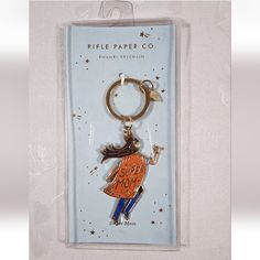 a keychain with a cartoon girl on it in a packaging for the kiffle paper co