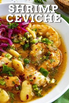 shrimp cevichche in a white bowl with red cabbage and green onions on the side