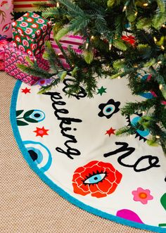 a christmas tree skirt with the words happy new year on it