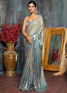 Elegant Silver Saree With Sequins, Glamorous Blue Saree For Reception, Evening Silver Saree With Zari Work, Silver Sequin Saree For Reception, Blue Sequined Evening Saree, Glamorous Blue Sequin Fabric For Festive Occasions, Festive Hand-embellished Sequin Fabric, Festive Hand Embellished Sequin Fabric, Silver Sequined Saree For Festive Occasions