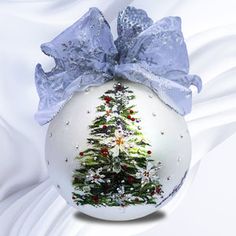 an ornament with a christmas tree on it