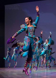 a group of people that are standing on a stage