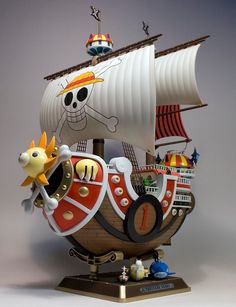 a toy pirate ship with lots of different things on it