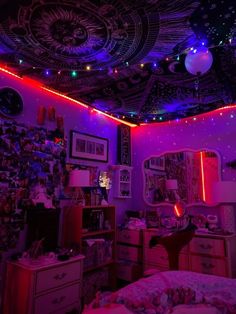 a bedroom decorated in purple and red lights