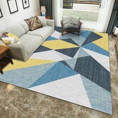 a living room with a couch, chair and rug