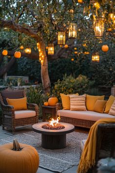 Cozy fall outdoor decor with pumpkins, lanterns, and string lights creating a warm ambiance around wicker seating and fire pit. Fall home vibes. Thanksgiving Porch, Fall Porches, Minimalist Autumn, Warm Browns, Autumn Home Decor, Fall Fragrance, Living Room Loft, Rustic Centerpieces, Small Space Gardening