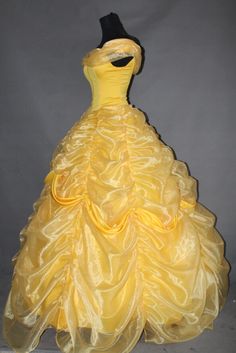 a yellow dress is shown on display