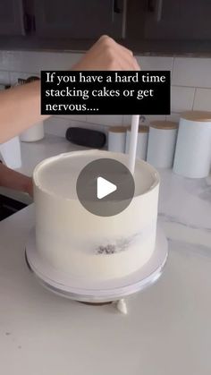 someone is decorating a white cake with the words if you have a hard time stacking cakes or get nervouss