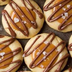 there are many cookies with chocolate drizzled on them