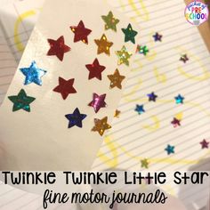 a close up of a piece of paper with stars on it and the words twinkle twinkle little star fine motor journals