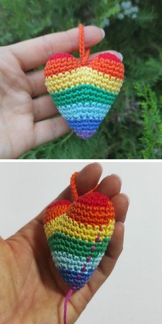 there is a crocheted heart in the shape of a rainbow