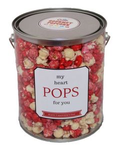 a canister filled with popcorn that says, my heart pops for you