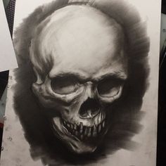 a drawing of a skull on paper