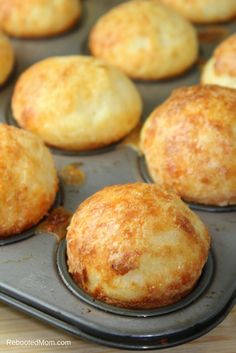 muffins are sitting on a baking tray ready to be baked in the oven