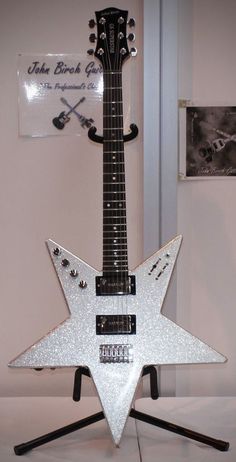 a guitar shaped like a star on top of a table