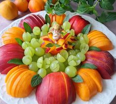 a white plate topped with lots of fruit