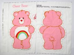 two pink teddy bears on white paper with rainbow in the center and one bear holding a heart