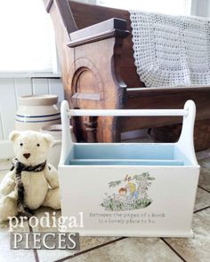 a white teddy bear sitting next to an old wooden chair with the words prodigal pieces written on it