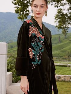 Experience the allure of Eastern luxury and elevate your everyday moments with this Luxury Velvet Kimono Robe for any occasion. Immerse yourself in the sumptuous feel of our ultra-soft, high-quality fabric, delicately adorned with stunning floral prints. - One size comfortably fits most- Up to 43" at chest and hips- A luxurious velvet robe with fur cuffs- Green velvet with vintage style flower embroidery- Front side tie closure - Belt loops and inside ties to secure closure- Relaxed fit with sli Embroidered Long Sleeve Robe For Loungewear, Long Sleeve Green Robe For Fall, Elegant Long Sleeve Kimono With Floral Embroidery, Elegant Long-sleeved Kimono With Floral Embroidery, Robe With Fur, Embroidered Robe, Embroidered Robes, Fur Cuffs, Velvet Kimono