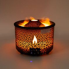 a lit candle that is sitting on a table