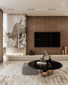 a living room with a large tv mounted on the wall and a black coffee table in front of it