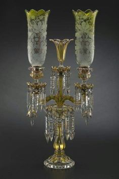 an image of a candle holder with crystal candlesticks on it's sides