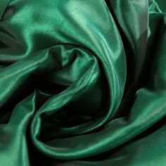 a close up view of a green fabric