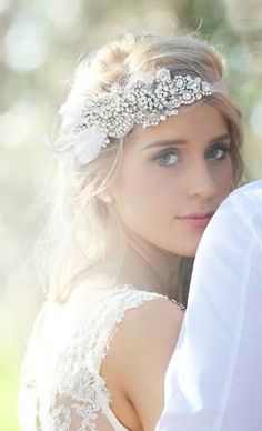 a woman wearing a bridal head piece