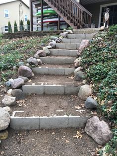 steps made out of concrete with rocks on each side