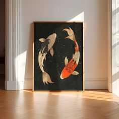 two koi fish swimming in the water under a framed art print on a wall