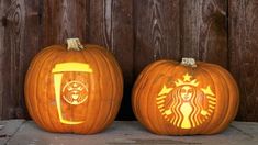 two pumpkins that have been carved to look like wine glasses and a clock tower