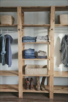 an image of a closet with clothes on shelves