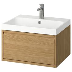 a bathroom sink with a wooden cabinet and faucet on the side, in front of a white background