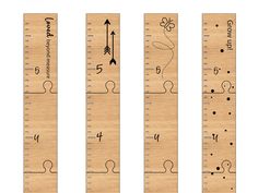 three wooden rulers with numbers and arrows on them