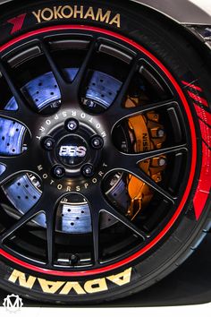 the wheels and rims of a sports car