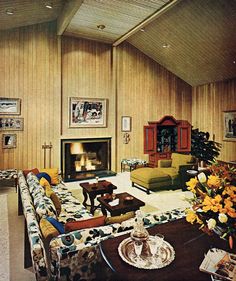 a living room with couches, chairs and a fire place in the fireplace area