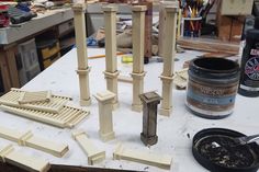 several pieces of wood sitting on top of a table next to some paint and tools