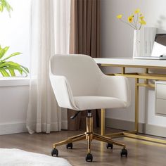 a white office chair sitting in front of a desk