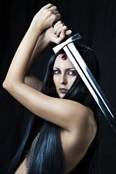 a woman with long black hair holding two swords over her head royalty photo - illustration