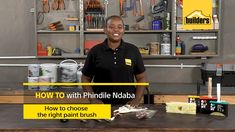 a woman standing in front of a table with tools on it