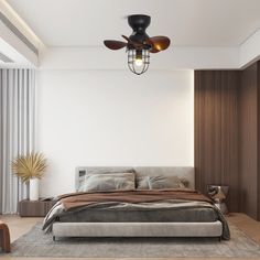 a bedroom with a large bed and ceiling fan