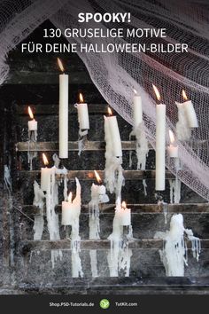 candles are lined up on the steps in front of a netted wall with text that reads spooky