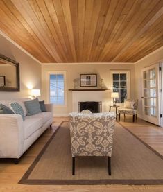 a living room filled with furniture and a fire place