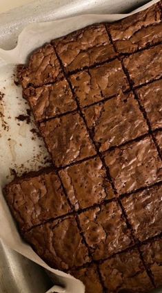 a pan filled with brownies sitting on top of a counter