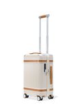 a white suitcase with brown stripes on the bottom and handle is shown in front of a white background