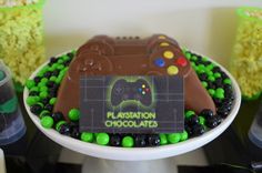 there is a cake that looks like a video game controller