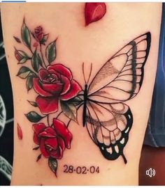 a tattoo with roses and a butterfly on it