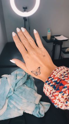 Butterfly hand tattoo Word Tattoos On Hand, Girly Hand Tattoos, Art Inspired Tattoos, Butterfly Hand Tattoo, Butterfly Tattoos For Women, Tattoos For Women Flowers, Healing Tattoo, Jesus Love