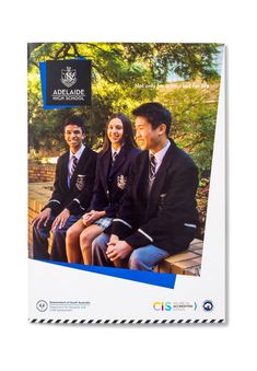 the front cover of a pamphlet showing three students sitting on a bench in school uniforms